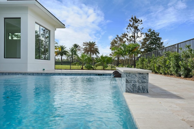 view of pool featuring pool water feature