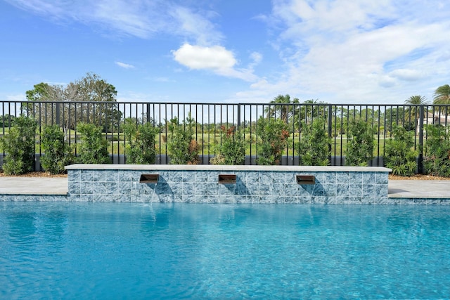 view of pool featuring pool water feature