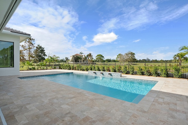 view of pool with pool water feature and a patio