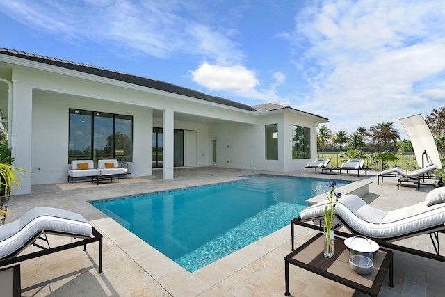 view of pool featuring a patio area and an outdoor hangout area