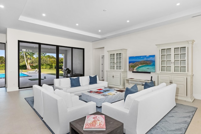 living room with a tray ceiling