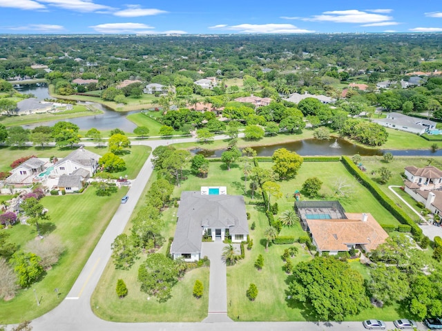 birds eye view of property with a water view