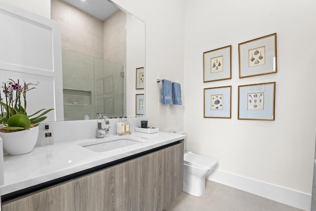 bathroom with tile patterned floors, vanity, toilet, and a shower with shower door