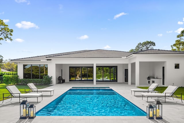 view of pool featuring a patio