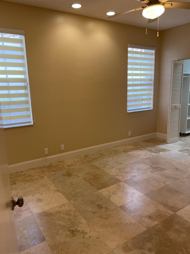 empty room featuring ceiling fan