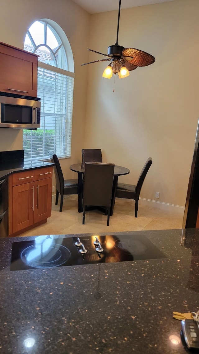 dining room featuring ceiling fan