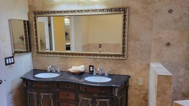 bathroom featuring tile walls and vanity