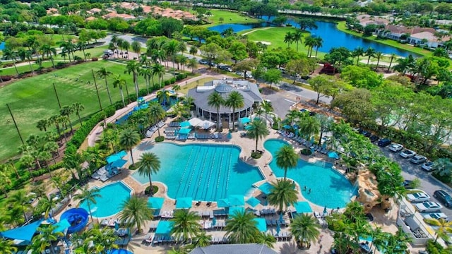 birds eye view of property with a water view