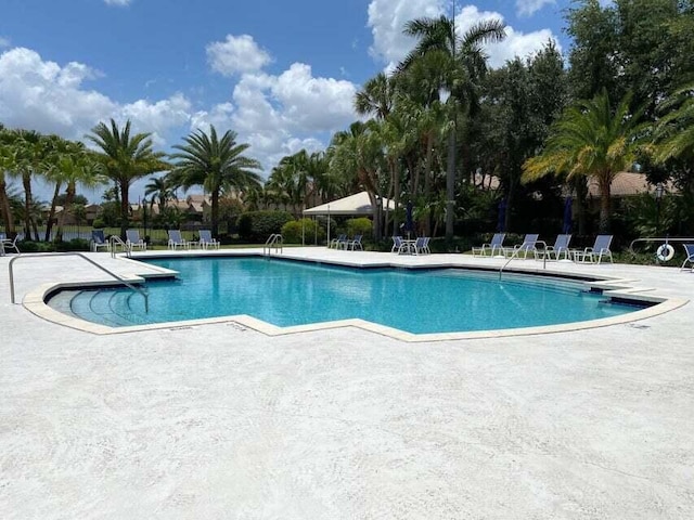 view of swimming pool with a patio area