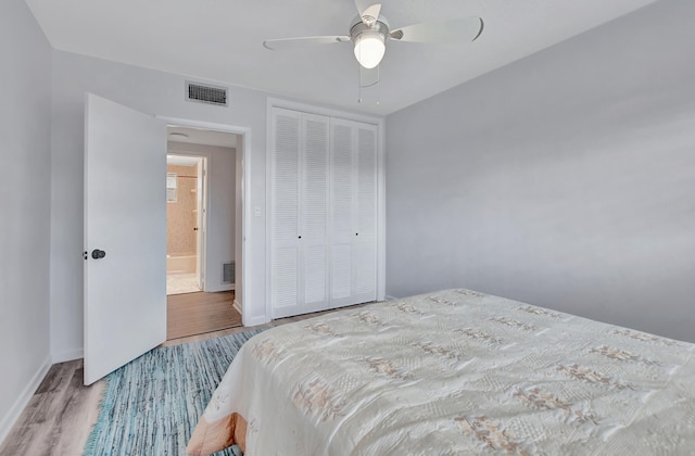 bedroom with a closet, ceiling fan, and light wood-type flooring