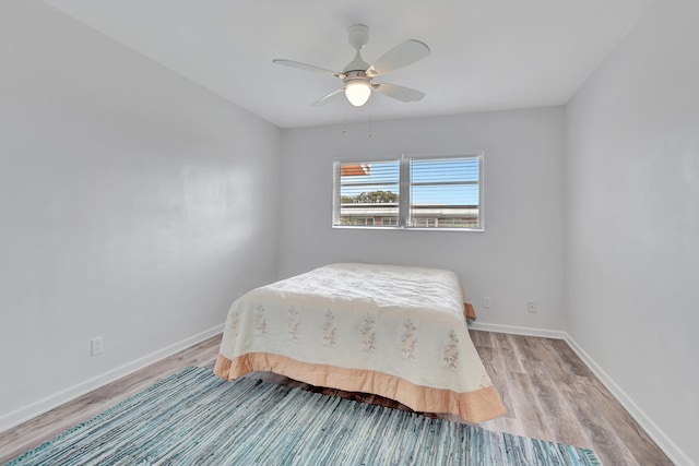 bedroom featuring ceiling fan and light hardwood / wood-style flooring