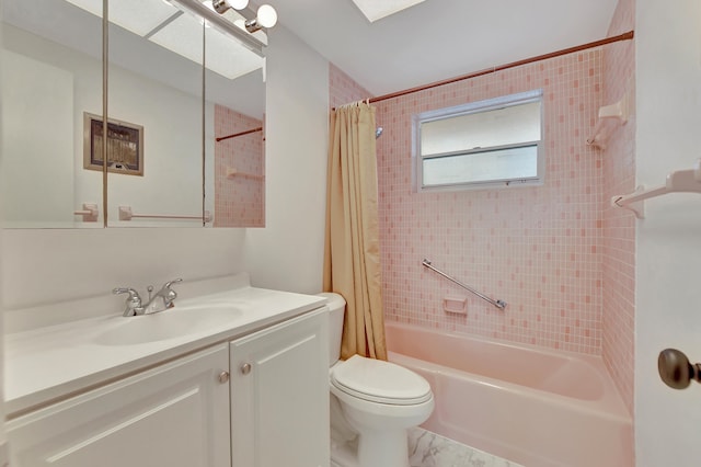 full bathroom with shower / tub combo, tile flooring, vanity with extensive cabinet space, and toilet