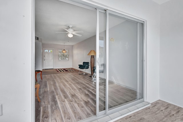 interior space featuring ceiling fan