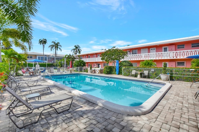 view of swimming pool featuring a patio area