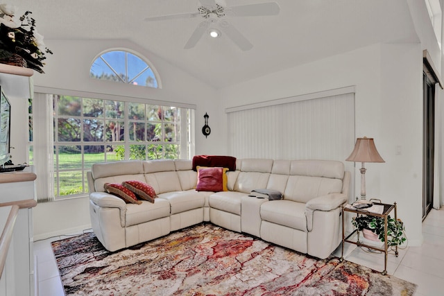 living room with light tile flooring, ceiling fan, and lofted ceiling