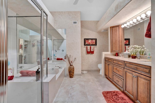 full bathroom featuring ceiling fan, dual vanity, tile flooring, toilet, and separate shower and tub