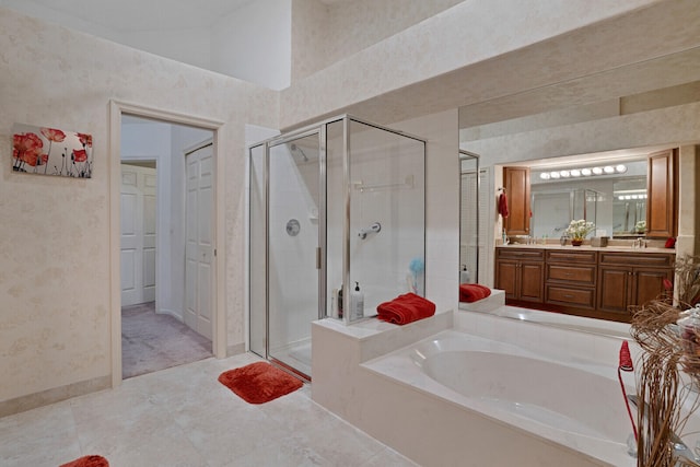 bathroom with oversized vanity, tile floors, and separate shower and tub