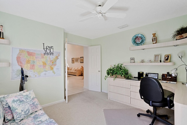 carpeted office with ceiling fan