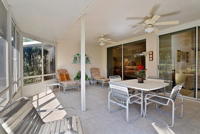 exterior space with ceiling fan