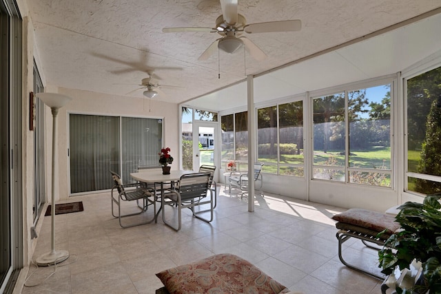 sunroom / solarium with a healthy amount of sunlight and ceiling fan