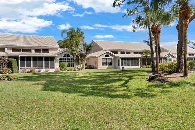 view of yard featuring a sunroom