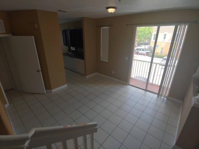 empty room with light tile floors