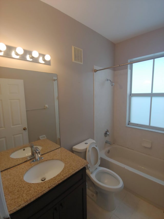 full bathroom featuring washtub / shower combination, vanity, tile floors, and toilet