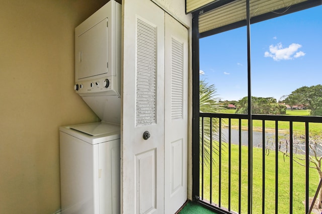 laundry area featuring stacked washer and dryer