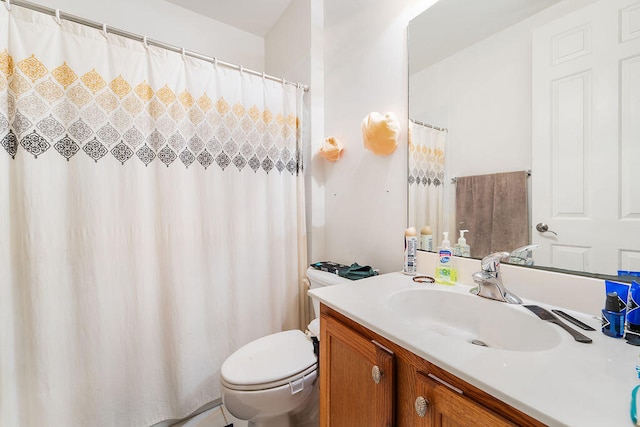 bathroom with toilet and vanity