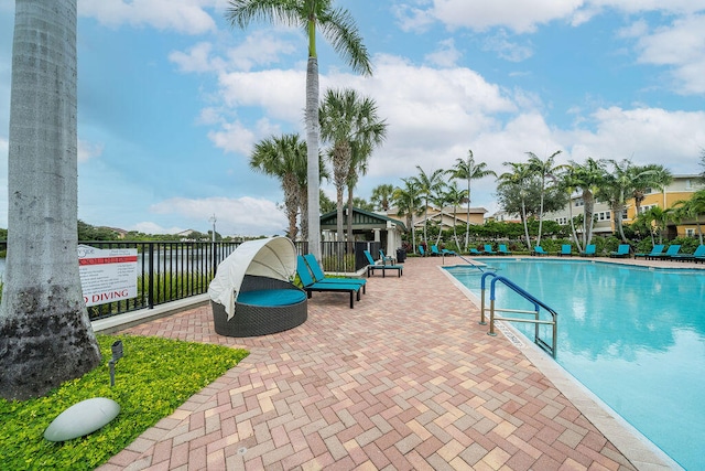 view of swimming pool with a patio