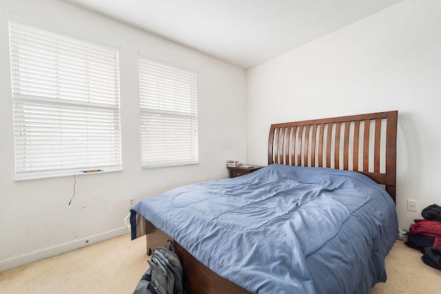 bedroom with light carpet