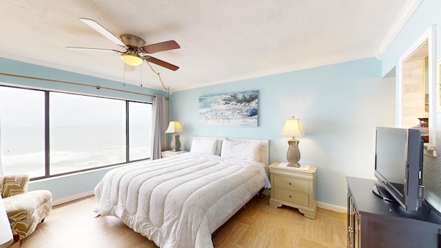 bedroom featuring light parquet flooring, ceiling fan, and ornamental molding