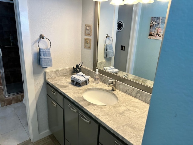 bathroom featuring tile floors and oversized vanity