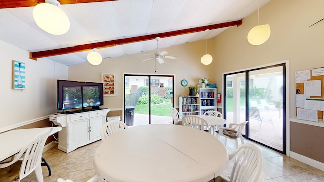 tiled dining area with vaulted ceiling with beams, ceiling fan, and a wealth of natural light