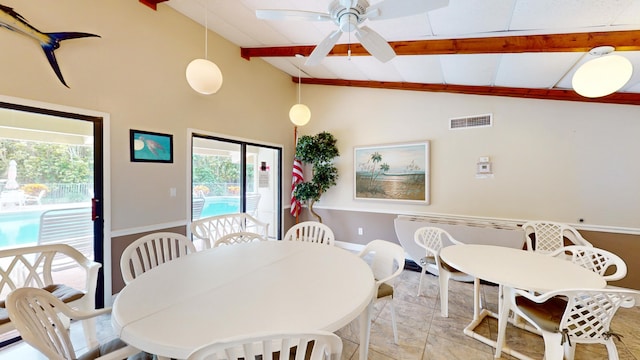 dining area featuring lofted ceiling with beams, ceiling fan, and light tile floors