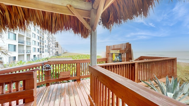 wooden deck featuring a water view