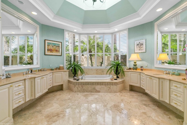 bathroom with a tray ceiling, tiled tub, oversized vanity, and tile floors