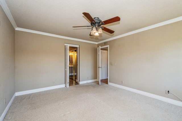 interior space with ornamental molding, ceiling fan, and a textured ceiling