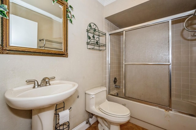 bathroom with shower / bath combination with glass door, toilet, and tile flooring