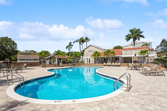 view of swimming pool featuring a patio area