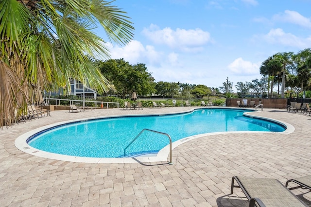 view of swimming pool featuring a patio area