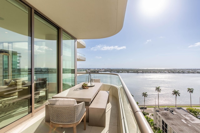 balcony featuring a water view