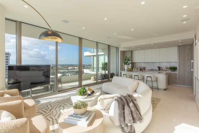 living room featuring a wall of windows