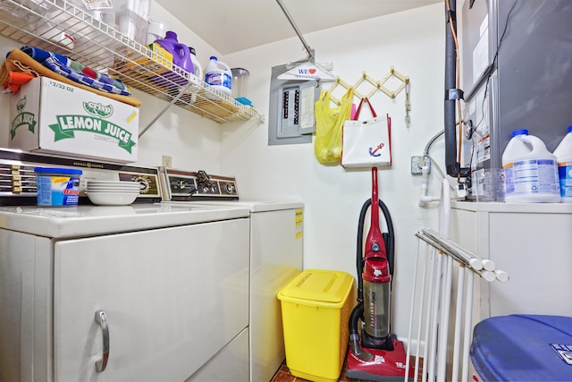 laundry area with washer and dryer and electric panel