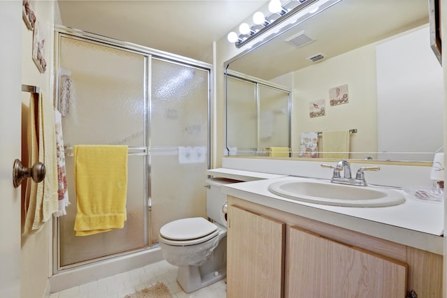 bathroom with walk in shower, tile patterned floors, vanity, and toilet