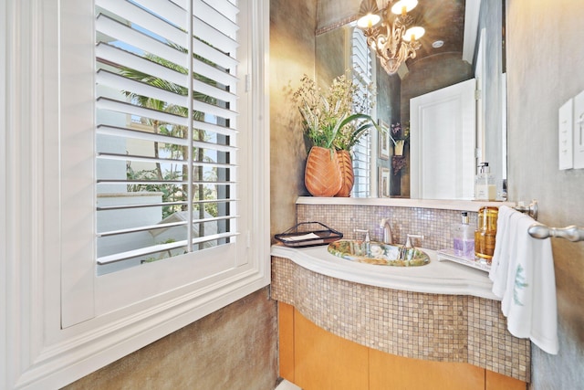 bathroom with vanity and a chandelier