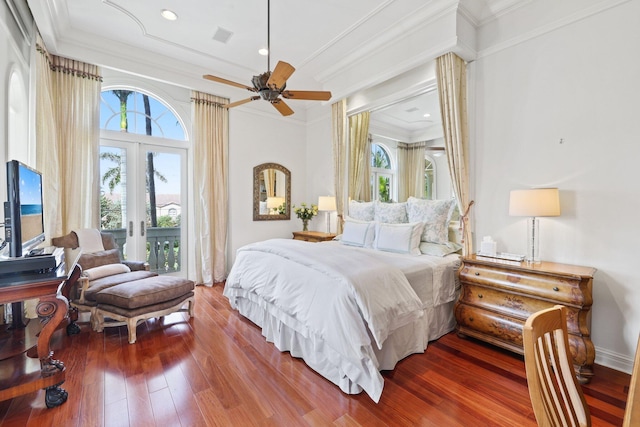 bedroom with dark hardwood / wood-style floors, multiple windows, and french doors