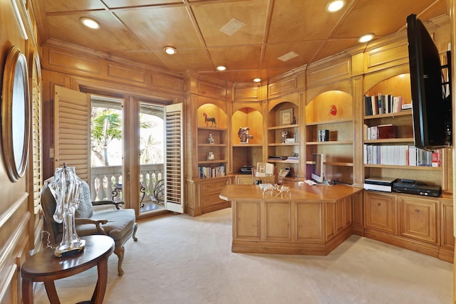 carpeted home office with wooden ceiling, wood walls, crown molding, and coffered ceiling