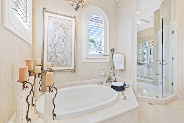 bathroom featuring ornamental molding, tile flooring, separate shower and tub, and a notable chandelier