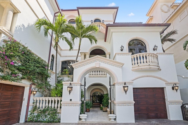 mediterranean / spanish-style home featuring a garage